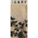 AN EARLY 20th CENTURY JAPANESE FRAMED SCROLL OF CRANES, resting on a pine tree, in black lacquer