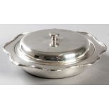A GEORGE VI SILVER BUTTER DISH, SHEFFIELD 1944, F.C., plain removable top, serpentine applied