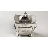 AN EDWARDIAN SILVER TEA CADDY, CHESTER 1910, W.B., of sarcophagus form, hinged top, body with two