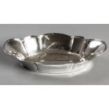 A .800 STD CONTINENTAL SILVER BOWL, of oval form with scallooped border, decorated with reeded