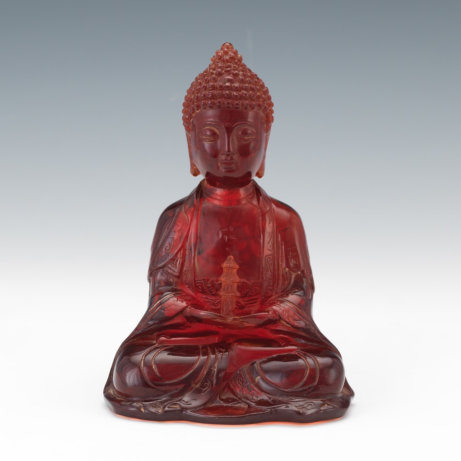 Consolidated Cherry Amber Sculpture of Buddha in Dhyana Mudra Holding Temple