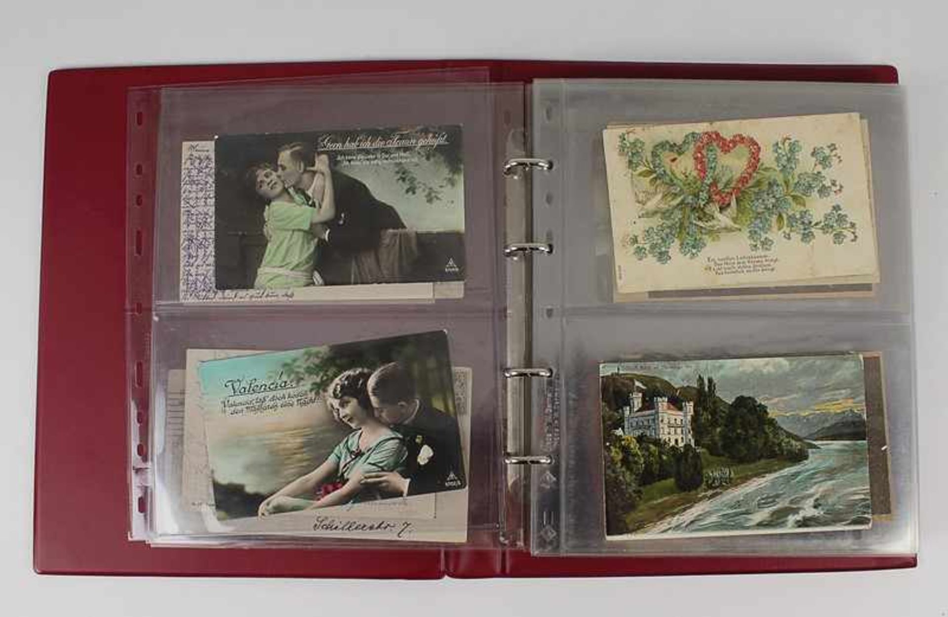Postkartenalbum um 1900-1920, s/w u. farbig lithogr., dabei Glückwunsch-, Kitsch-, Correspondenz-