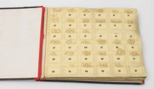Musterbuch "Monograms" Ende 19. Jh., 100er`te Monogramme aus goldfarbener Pappe gestanzt