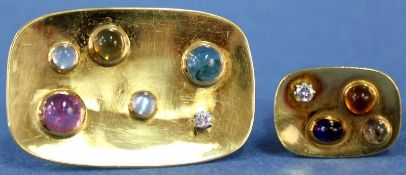 Ring und Brosche. Gelb - Gold 750. Auch 2 Brillanten a' circa 0,1 Karat. 26,5 Gramm Gesamtgewicht.