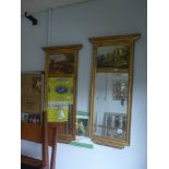 A pair of rectangular gilt-framed bevelled glass mirror with painted panels of countryside scenes