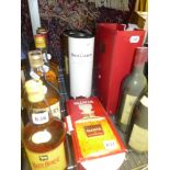 A bottle of Grant's whisky, 70 cl, in original tube, a 68 cl presentation decanter of MacDonald's