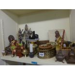 A shelf of metal Asian and Oriental items including figurines of deities and other ornaments [sz]