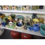 A shelf of Art Deco china comprising jugs, bowls and part tea services including Bretby, Poole,