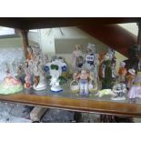 A collection of figurines including a Staffordshire flatback figurine of a couple, Little Red Riding