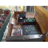 A carton of costume jewellery in various boxes including bracelets, bangles, beads and rings