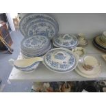 An Almcee Woodland pattern blue and white part dinner service including tureens and meat plates, a