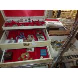 A good lot of costume jewellery in a three-tier jewel box and other boxes, including aneternity
