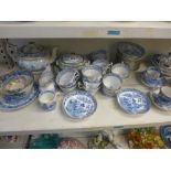 A shelf of blue-printed English porcelain tea ware, early 19th century, including Mason's, mostly