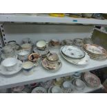 A shelf of interesting English ceramics, late 18th to early 19th century, including cups, saucers,