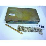 A 9 ct gold swizzle stick and a silver gate bracelet and padlock, in a metal cigarette box ONLINE
