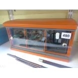 An Underwood electric watch winder, for three watches, in orange leather [B] ONLINE BIDDING IS