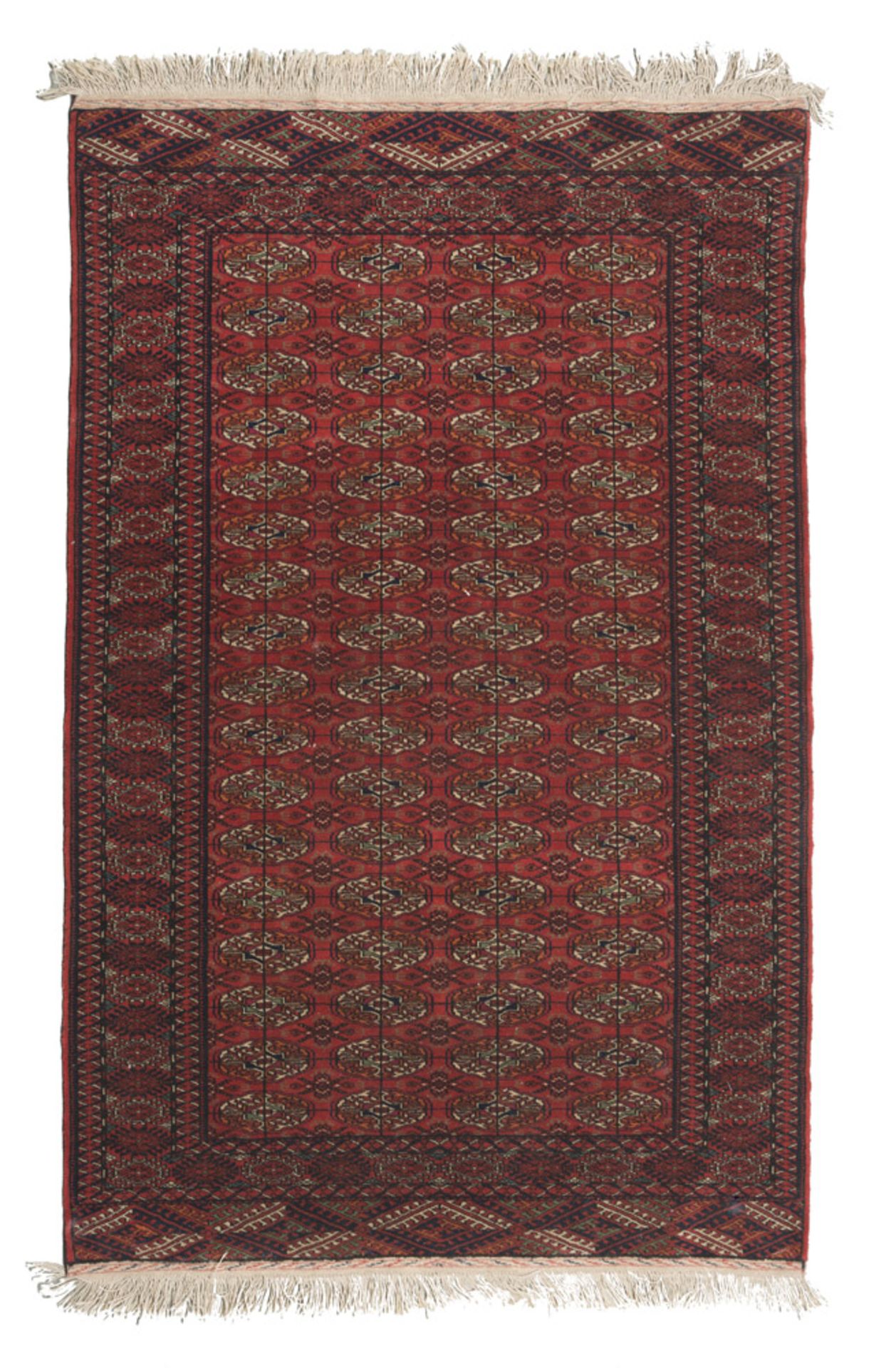 KURDISH CARPET, MID 20TH CENTURY bokara design in the center field central on red ground. Measures