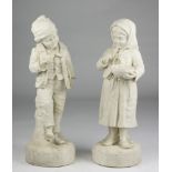 A PAIR OF BISCUIT SCULPTURES, 20TH CENTURY representing young little boys. Plain basement.