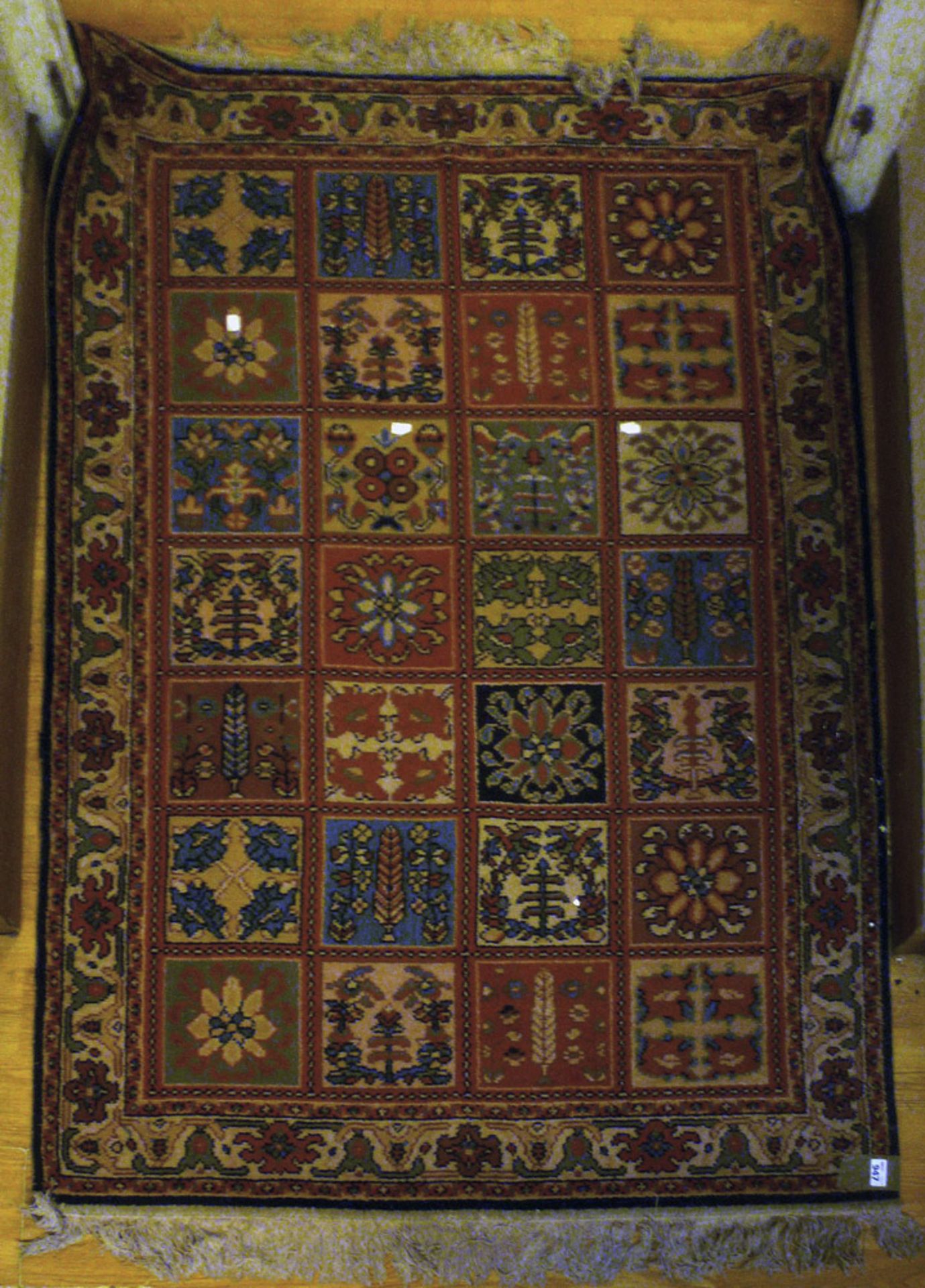 LOOM MECHANICAL CARPET, 20TH CENTURY design 'baktiari' to tiles. Measures cm. 180 x 120. TAPPETO A