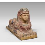 SCULPTURE OF THE SPHINX IN LACQUERED WOOD, 19TH CENTURY in polycromy. Measures cm. 50 x 80 x 32.