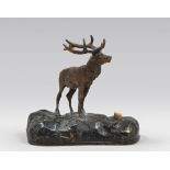 SMALL SCULPTURE OF ELK, EARLY 20TH CENTURY in gilded metal, with rocks base in burnished metal.