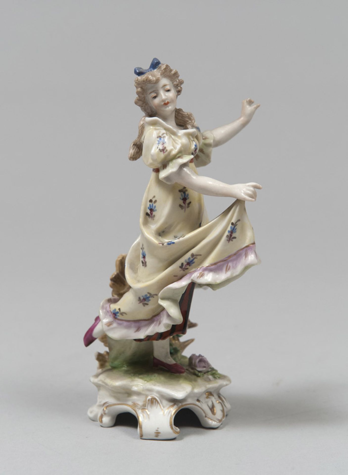 PORCELAIN FIGURE OF A YOUNG GIRL, GERMANY EARLY 20TH CENTURY in polychromy with plain basement.