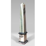 OBELISK IN CIPOLLINO MARBLE, 19TH CENTURY with frames in black marble of Belgium and base in