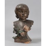 YOUNG GIRL'S BUST IN EARTHENWARE, EARLY 20TH CENTURY enamaled to fake bronze, with flowers in relief