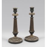 A PAIR OF METAL AND BRONZE CANDLESTICKS, EMPIRE PERIOD with gilt and burnished patina, with stem.