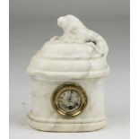 SMALL CLOCK IN WHITE MARBLE, 19TH CENTURY with figure of dog on the hat and quadrant in brass.