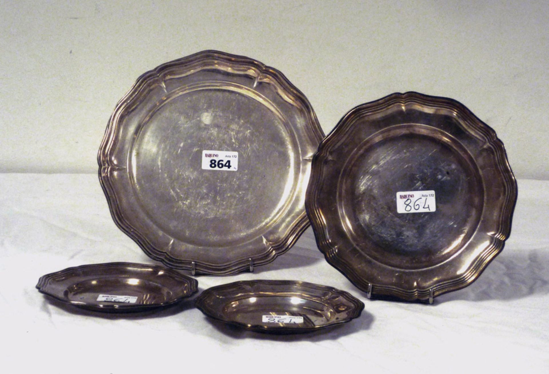 EIGHT SILVER DISHES, 20TH CENTURY moved and ribbed edge Diameter cm. 36, cm. 20, cm. 16 and cm.