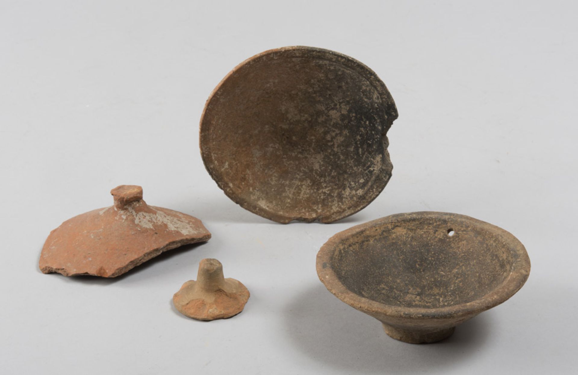 TWO COVER-DISHES AND TWO COVERS, 2ND CENTURY A.C. - 2ND CENTURY D.C. In orange terracotta. Dishes