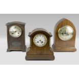 THREE TABLE CLOCKS, ENGLAND LATE 19TH CENTURY cases in mahogany and oak. One with inlays in fruit