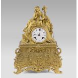 SMALL PARISIAN CLOCK IN ORMOLU, 19TH CENTURY with allegorical female figure on the hat. Decorated