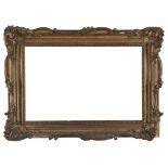 FRAME, 19TH CENTURY in wood and gilded plasters decorated with leaves, roccailles and flowers. Inner