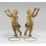 A PAIR OF CHERUB'S SCULPTURES, NORTHERN ITALY 17TH CENTURY in lacquered wood, with fleece in gilt