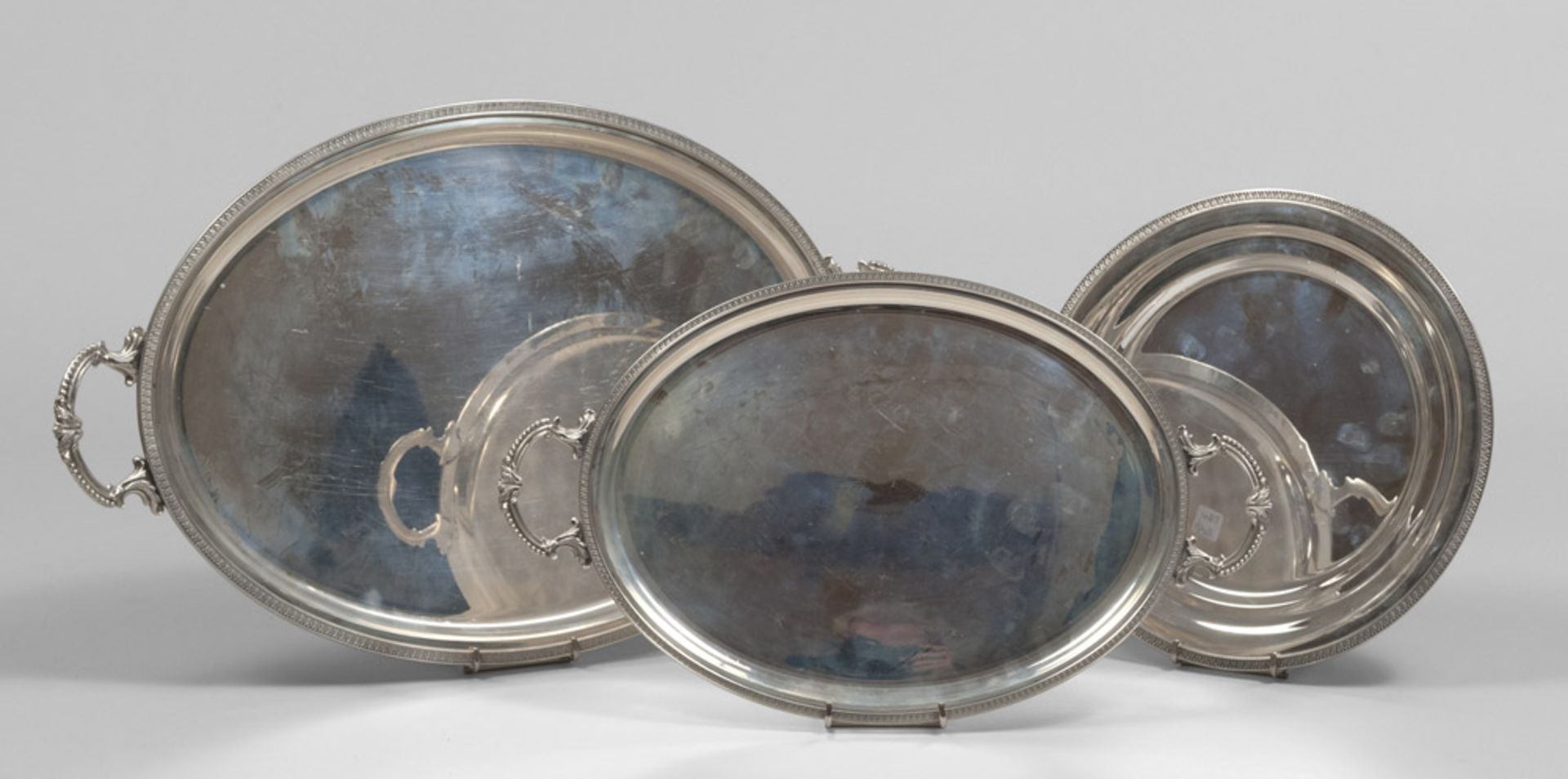 TWO SILVER TRAYS AND ONE DISH, 20TH CENTURY. Measures tray max. cm. 53 x 33, total weight gr.