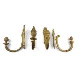 TWO PAIRS OF CURTAIN RODS, BEGINNING OF 19TH CENTURY in ormolu, with twisted arms and finals as