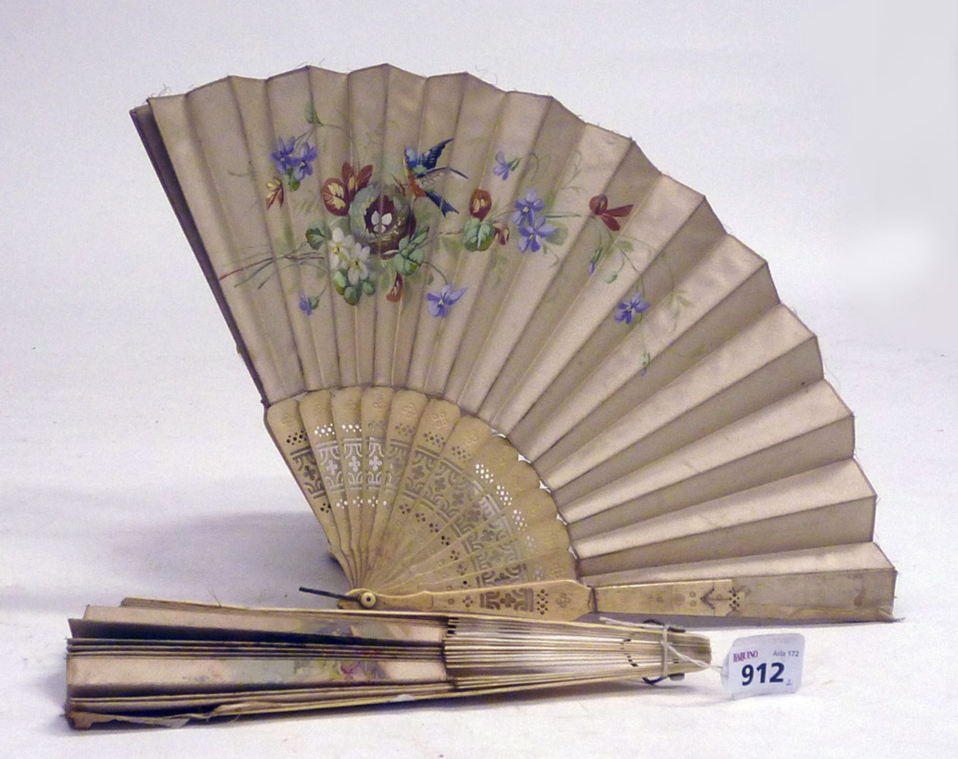 TWO FANS, EARLY 20TH CENTURY in silk decorated with rural scene and flowers. Sticks in pierced
