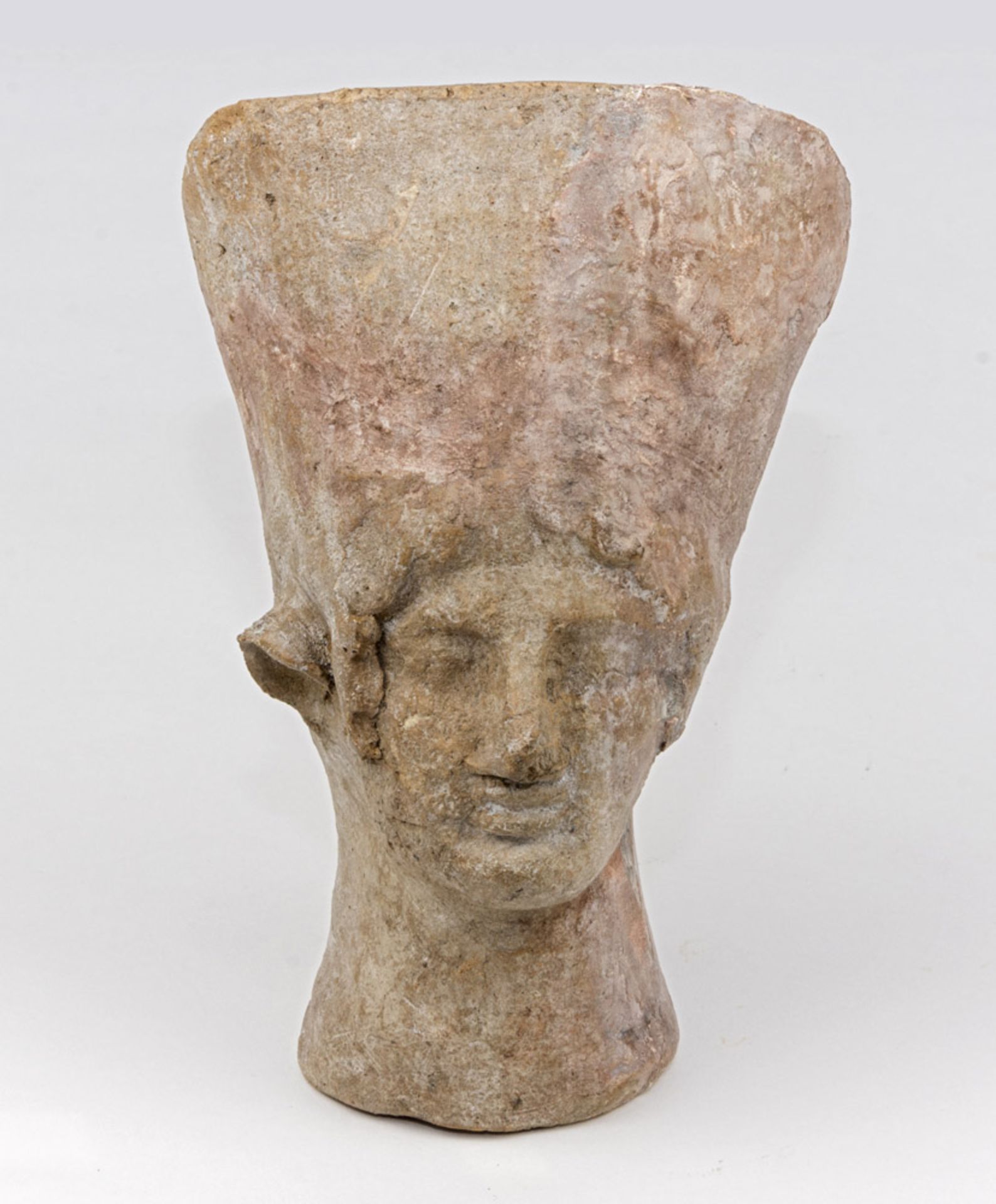 ETRUSCAN VOTIVE FEMALE HEAD, 6TH-5TH CENTURY B.C. Measures cm. 25 x 15. TESTA FEMMINILE VOTIVA,