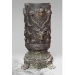 SMALL BRONZE COLUMN, LATE 19TH CENTURY decorated by high-relief classical heads, draperies and