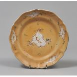 MAIOLICA DISH, LATE 18TH CENTURY entirely ocher glaze, with reserves with floral motifs. Diameter