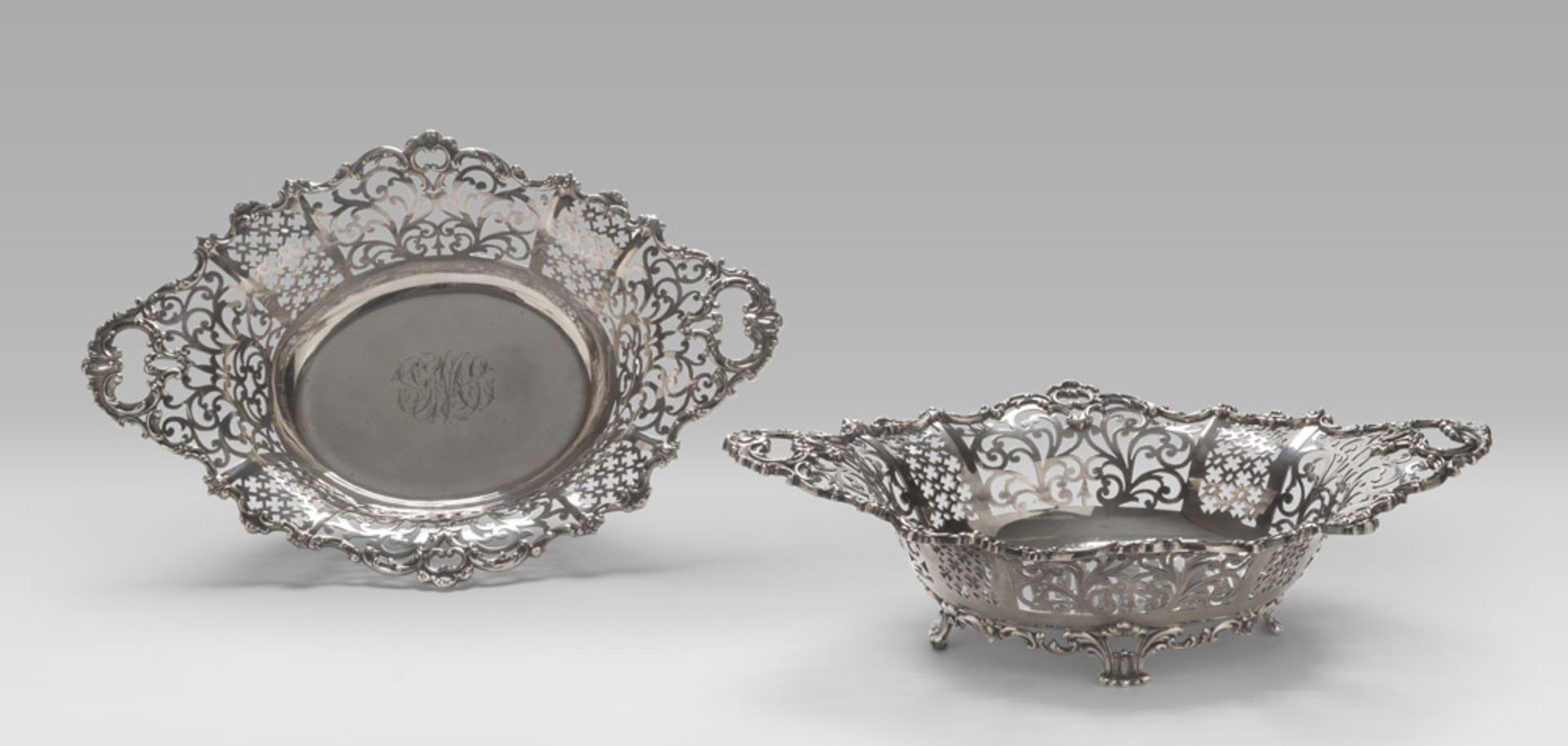 A PAIR OF SILVERBASKETS, PUNCH NEW YORK 1896 with edge pierced to vegetable motifs. Leaves feet.