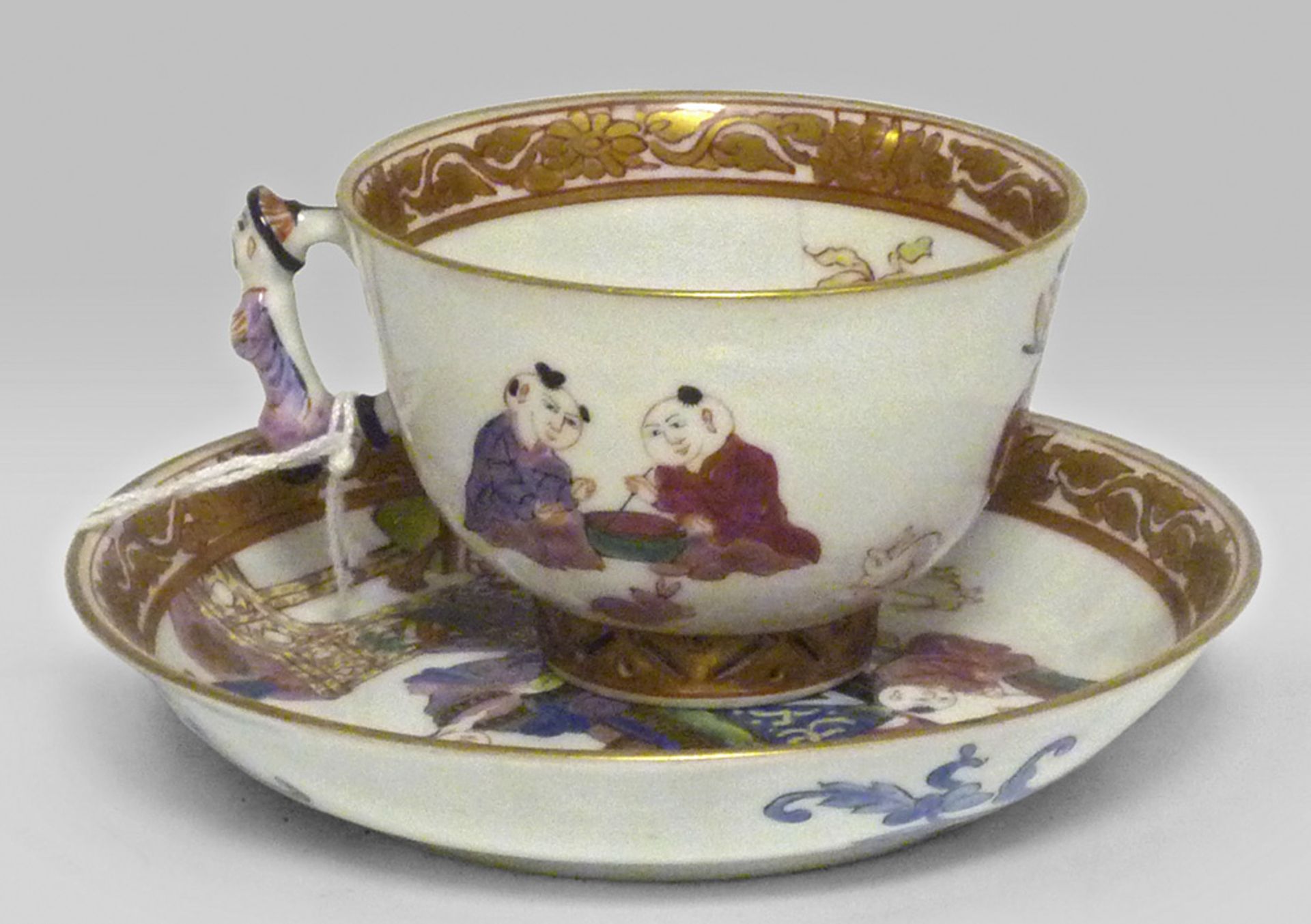 A CHINESE POLYCHROME PORCELAIN CUP AND SUCER, 20TH CENTURY