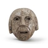 A SCHIST MASK, PROBABLY FAR EAST, EARLY 20TH CENTURY.