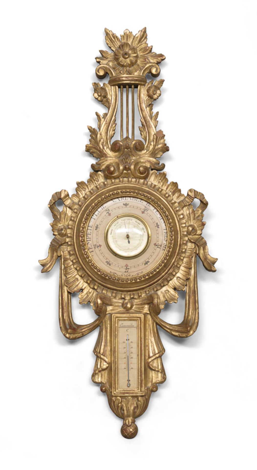 BAROMETER AND THERMOMETER, 20TH CENTURY in giltwood, graven to Luigi XVI motifs. Measures cm. 100
