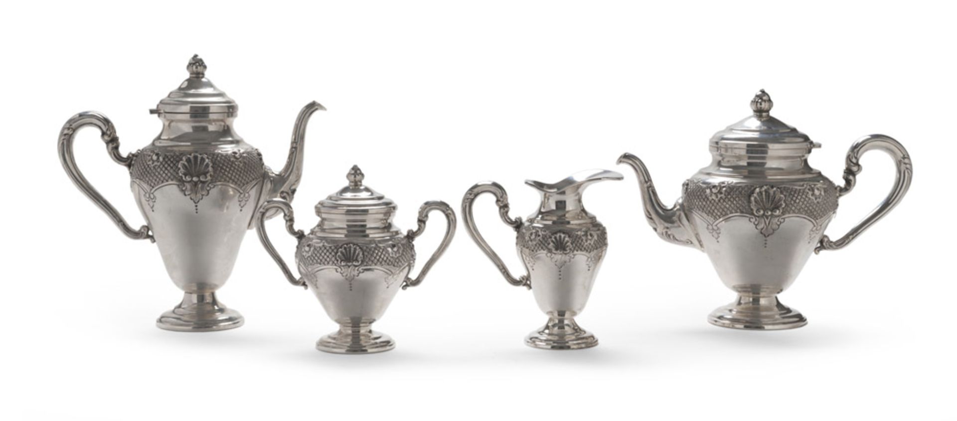 SILVER TEA AND COFFEE SERVICE, 20TH CENTURY body with chisels of shells and leaves on gird