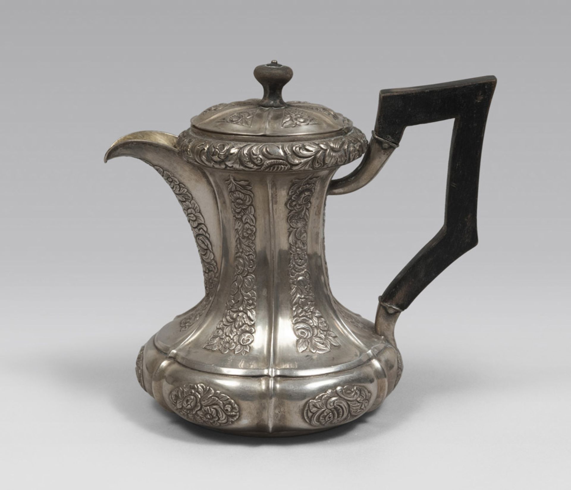 SILVER TEAPOT WITH EBONY HANDLE, PROBABLY AUSTRIA LATE 18TH CENTURY. Measures cm. 19 x 15 x 22,