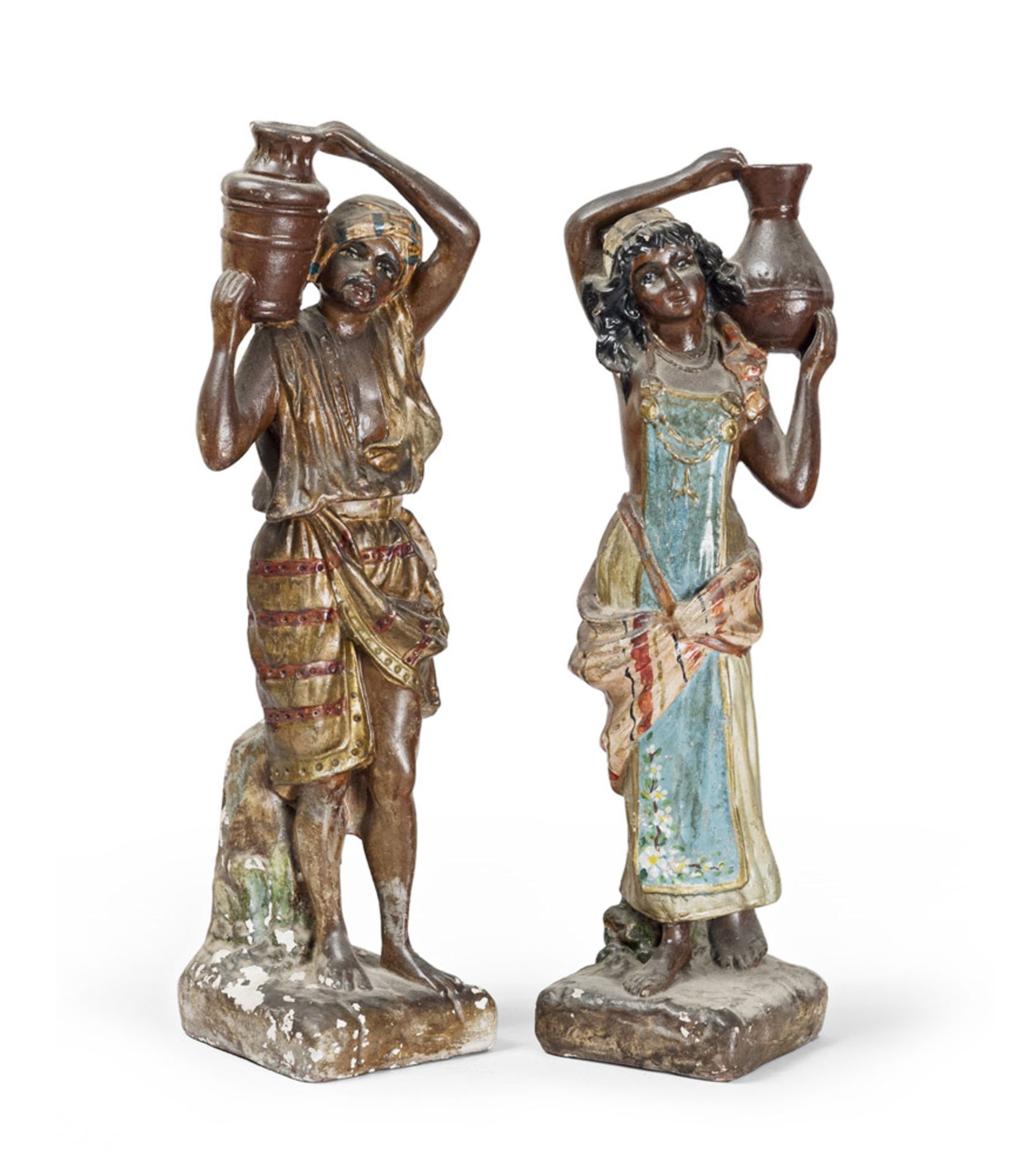 A PAIR OF PLASTER SCULPTURES, FIRST HALF 20TH CENTURY in polychrome, representing bearer and carrier