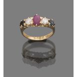 RING RIVIERE in yellow gold 18 kts., decorated with ruby, two sapphires and two diamonds. Diamond